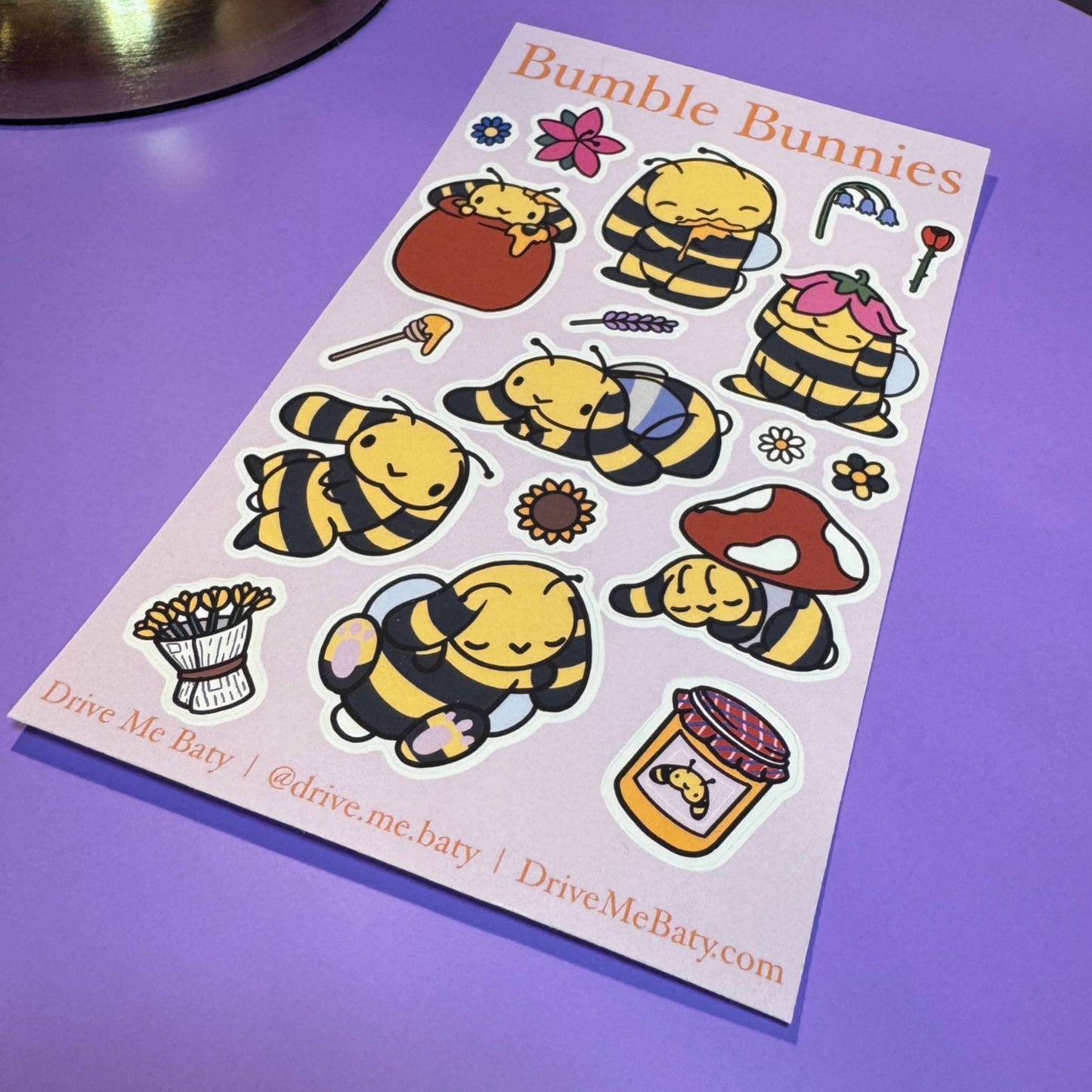 Sheet of 'Bumble Bunnies' stickers on a purple surface