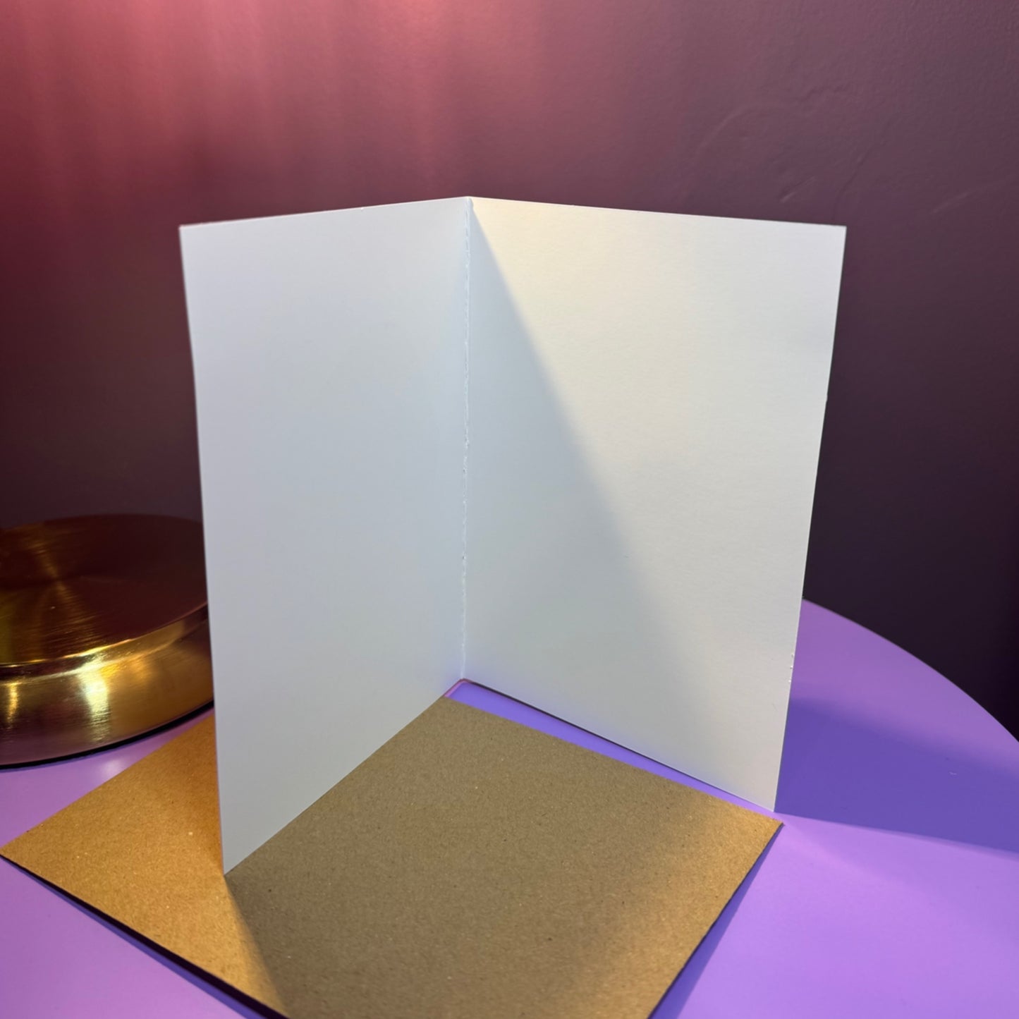 White card on a purple surface