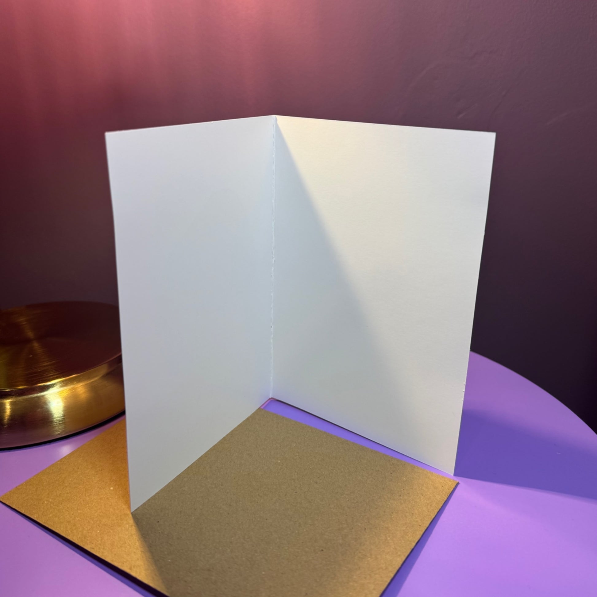 White card on a purple surface